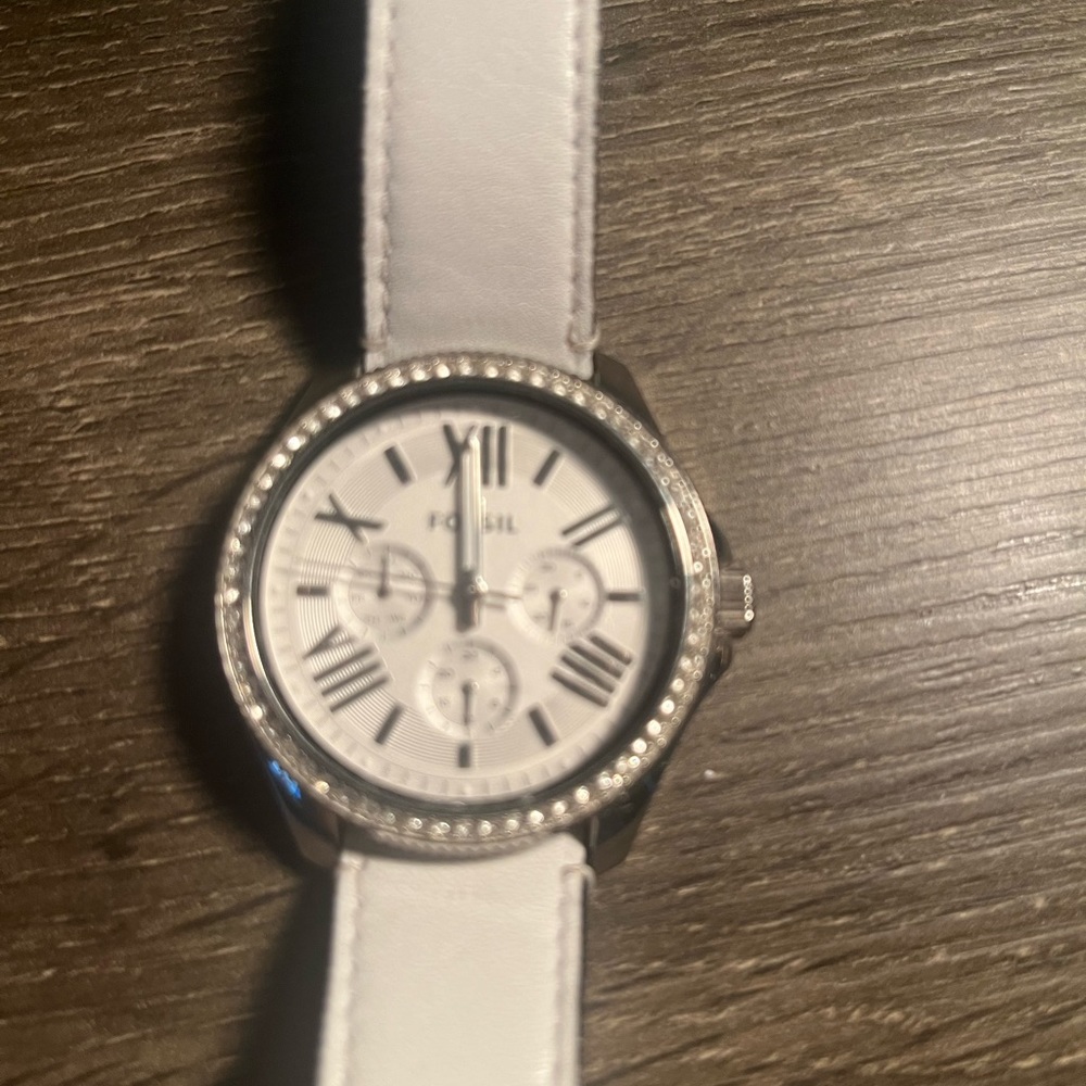 Fossil watch in white with leather strap.